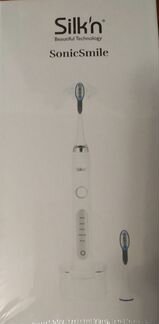 Электрическая зубная щетка