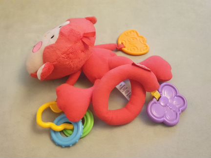 Fisher Price Музыкальная подвеска на коляску Обезь